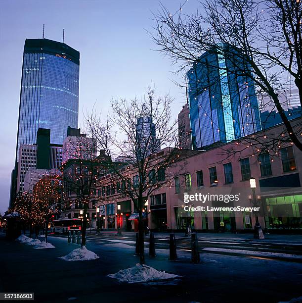 downtown winter cityscape of minneapolis, minnesota at dusk - minneapolis winter stock pictures, royalty-free photos & images