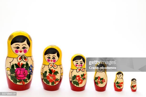 russian matryoshka dolls in different sizes - russian nesting doll stock pictures, royalty-free photos & images