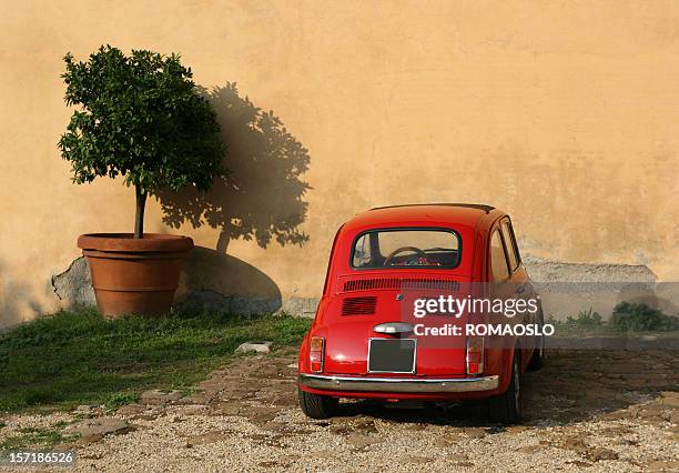 old red mini under a tree in rome italy - car profile stock pictures, royalty-free photos & images