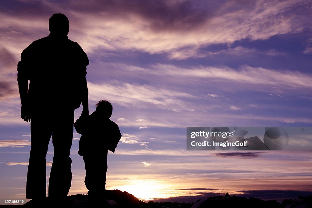 Father Holding Hands With Child Silhouette High-Res Stock Photo