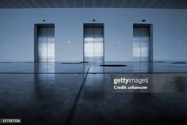 elevators - elevator doors stock pictures, royalty-free photos & images