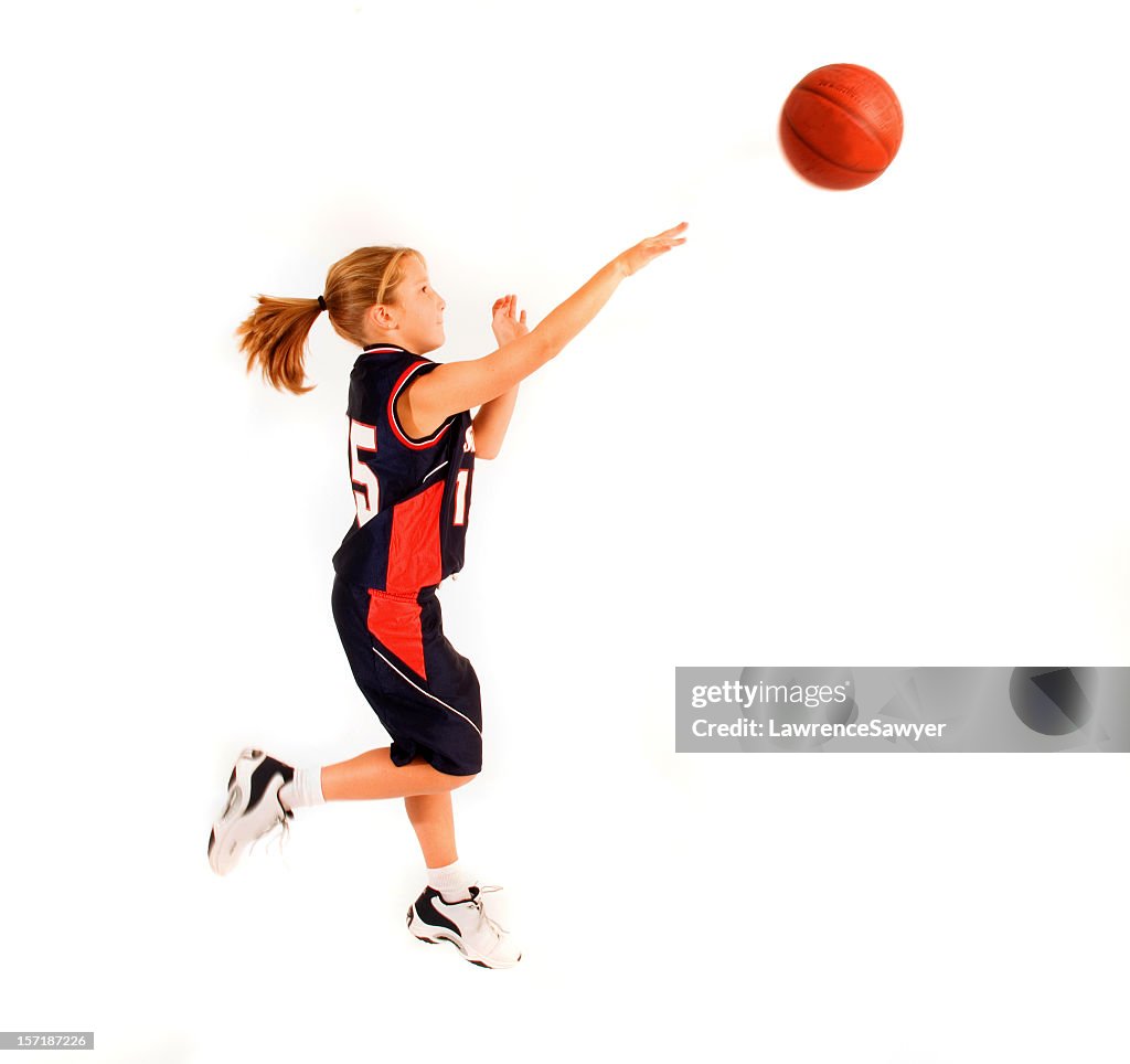 Young girl throwing basketball