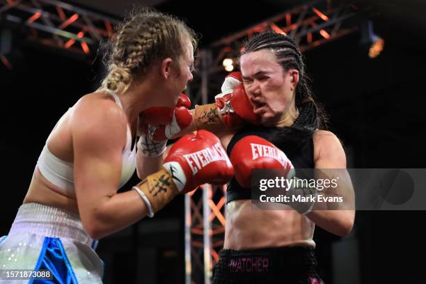 Ella Boot , throws a punch on Annie Thatcher in their Super-lightweight bout at Hoops Capital East on July 26, 2023 in Sydney, Australia.