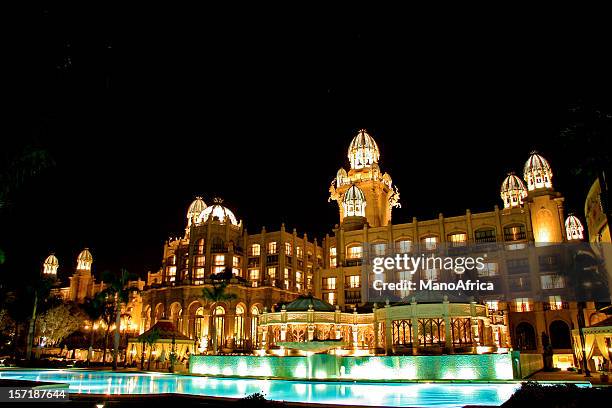 the palace lost city night time - lost city south africa stock pictures, royalty-free photos & images