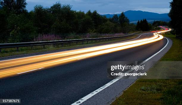 scottish road at night - winding road night stock pictures, royalty-free photos & images