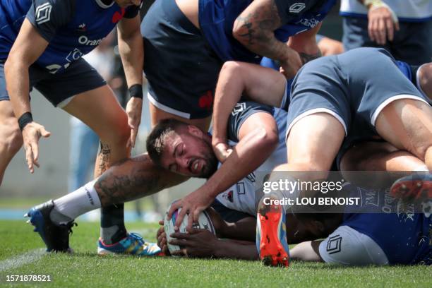 France's number eight Gregory Alldritt holds the ball in a scrum during a training session, as part of France's national rugby union team's...