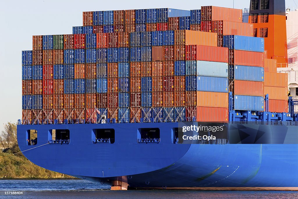 Blue containership with cargo containers