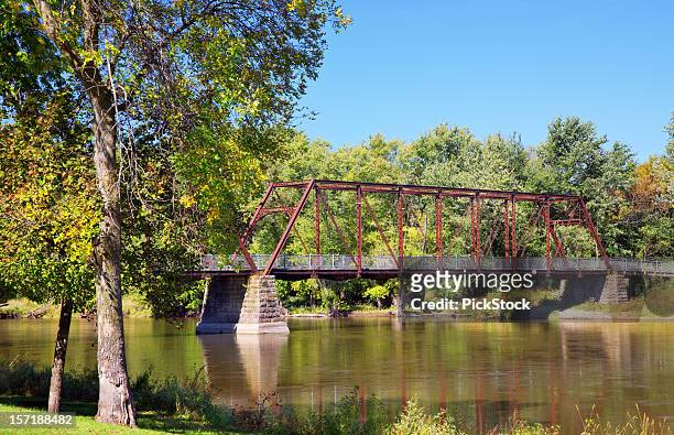 bridge on peaceful river - iowa stock pictures, royalty-free photos & images