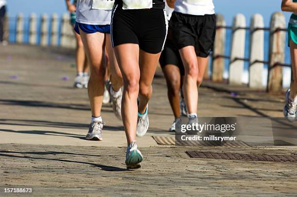 runners on the road - ultra marathon stock pictures, royalty-free photos & images