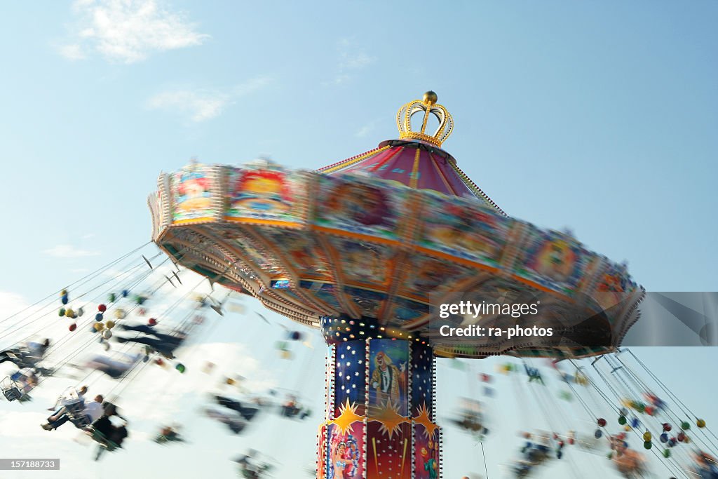 A motion blurred photo of a chairoplane