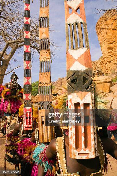 four dogon dancers, masks and stilts - dogon stock pictures, royalty-free photos & images
