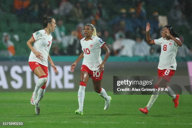 Julia Grosso, Ashley Lawrence and Jayde Riviere of Canada celebrate the team's first goal scored an own goal by Megan Connolly of Republic of Ireland...