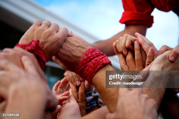 castellers hands - human pyramid stock pictures, royalty-free photos & images