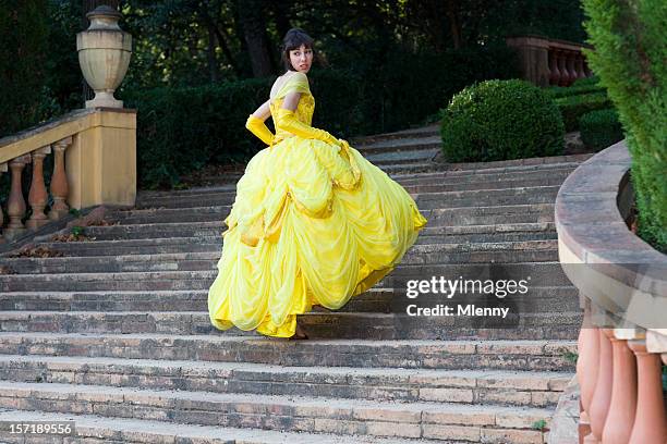 fairy tale beautiful girl lost her shoe - girl in yellow dress stock pictures, royalty-free photos & images