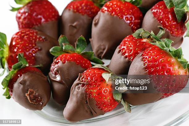 chocolate dipped strawberries in clear glass plate on white tablecloth - chocolate dipped stock pictures, royalty-free photos & images