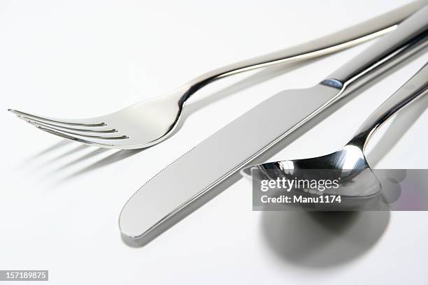 fork,knive and spoon isolated on white background - table knife stock pictures, royalty-free photos & images