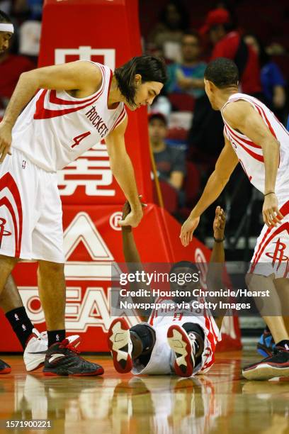 Houston Rockets point guard Jonny Flynn gets help from Houston Rockets power forward Luis Scola and Houston Rockets shooting guard Kevin Martin...