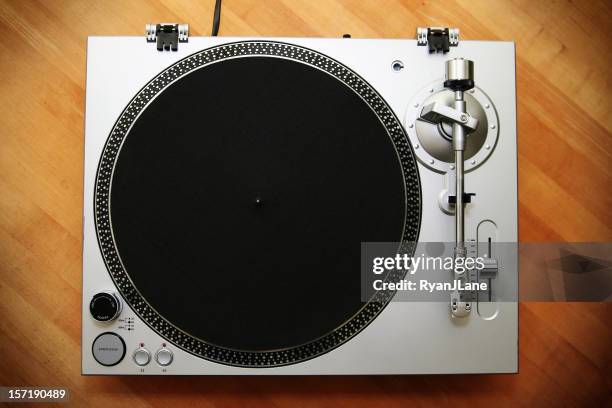 chrome turntable / record player on wood background - deck stockfoto's en -beelden