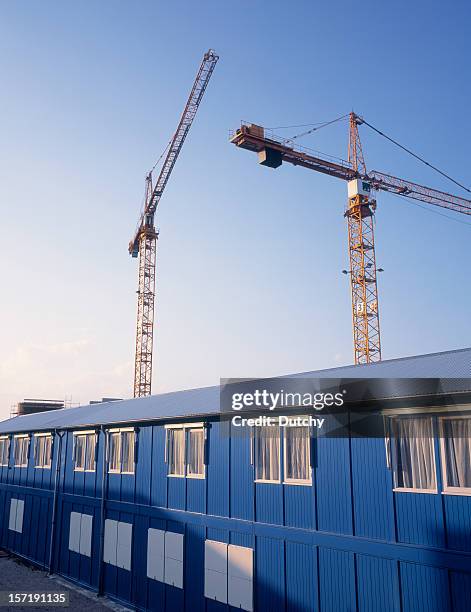 two cranes located at a building site - barracks 個照片及圖片檔