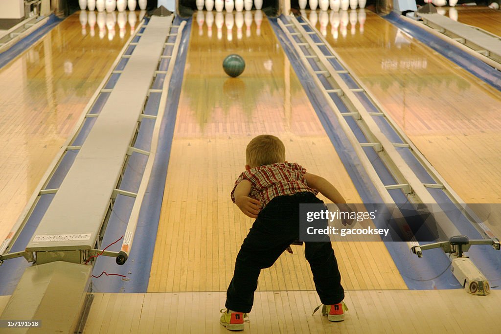 Young boy bowling