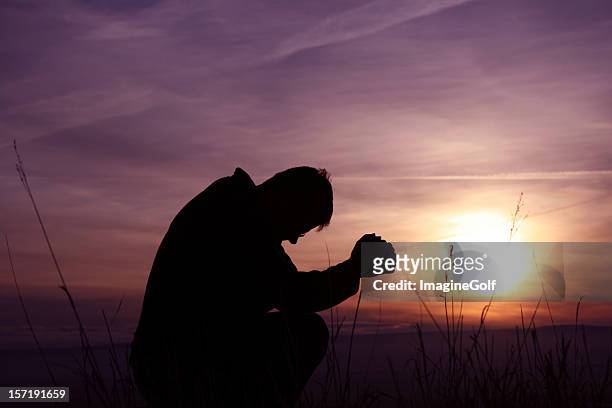 morning prayer silhouette - god worship stock pictures, royalty-free photos & images