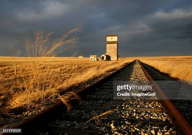 abandoned railway and train track on the prairie - alberta prairie stock pictures, royalty-free photos & images
