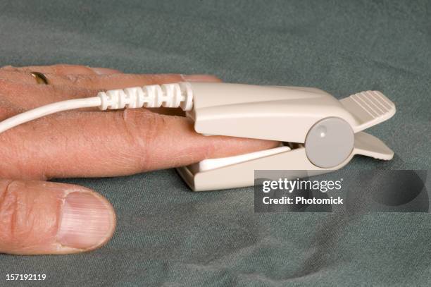O2 Sensor Finger Tips Oxygen Saturation Monitor Photos and Premium High Res Pictures - Getty ...