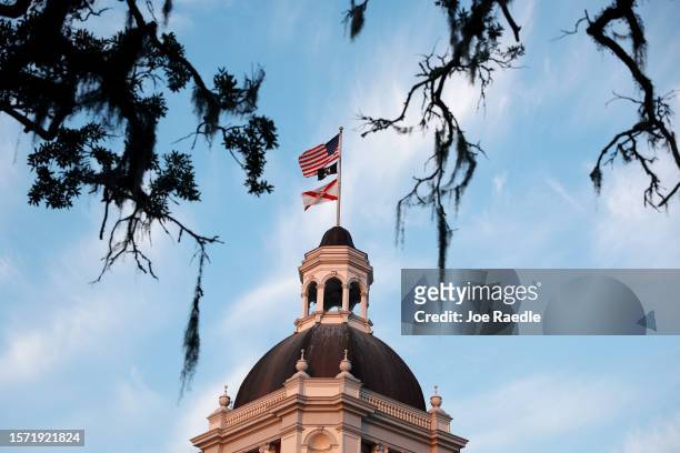 Flags fly atop the Florida Historic Capitol that is located near the 22-story New Capitol building, which together are part of the Capitol Complex on...
