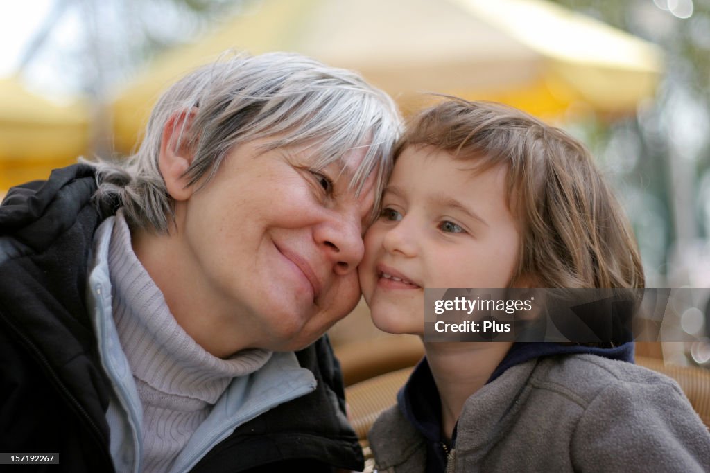 Grandma and granddaughter cuddling