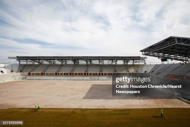 Workers groom the newly laid sod at the BBVA Compass Stadium where the Houston Dynamo soccer team will soon be playing, Wednesday, Feb. 8 in Houston....