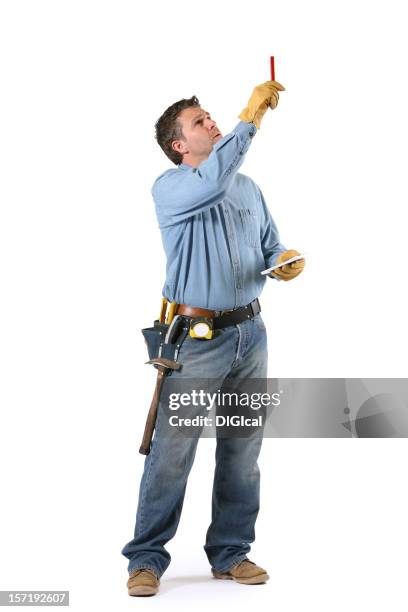 a construction worker taking measurements for a building - construction worker on white stock pictures, royalty-free photos & images