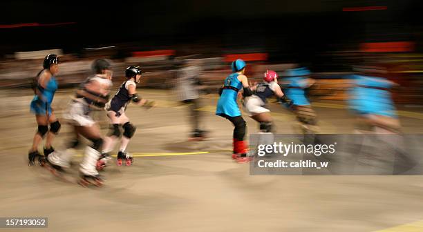 roller derby pack in motion - roller rink stock pictures, royalty-free photos & images