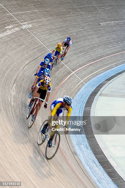 cyclists racing in bicycle velodrom - cycling track stock pictures, royalty-free photos & images