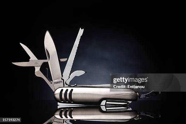 isolated gray pocket knife with its tools extended - swiss army knife stock pictures, royalty-free photos & images