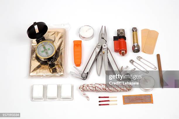 contents of a survival kit on display - first aid kit stock pictures, royalty-free photos & images