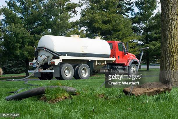 septic tank maintenance - toxin stockfoto's en -beelden