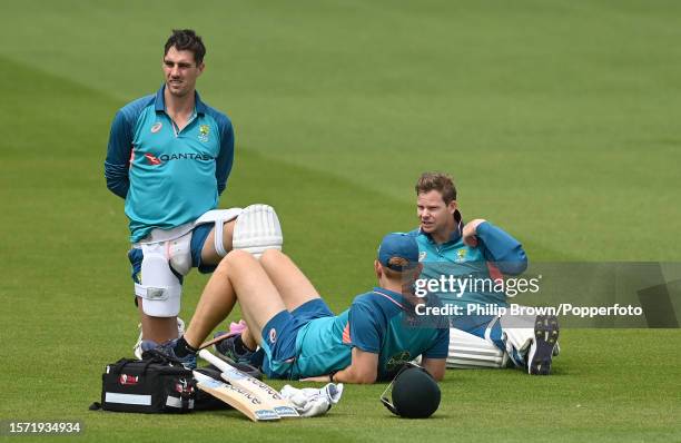 Pat Cummins , Andrew McDonald and Steve Smith of Australia look on during a training session before the 5th Test between England and Australia at The...