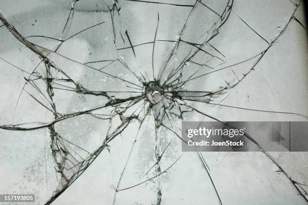 broken glass window bullet shooting impact hole cracks - fracture stock pictures, royalty-free photos & images