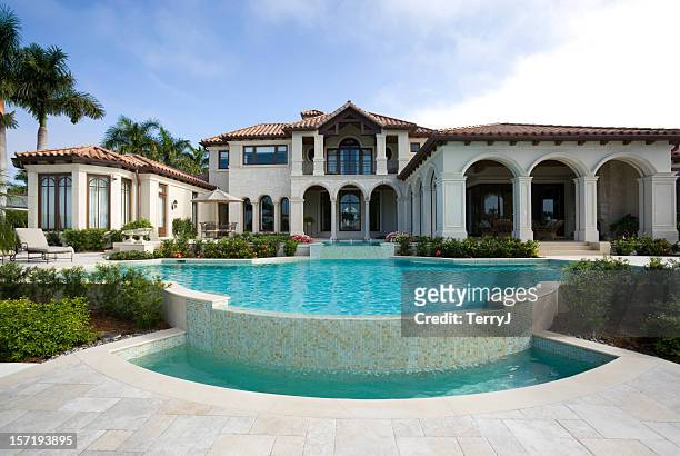 beautiful swimming pool at an estate home - luxury stock pictures, royalty-free photos & images