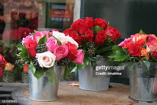 bunches of roses - flower bucket stock pictures, royalty-free photos & images