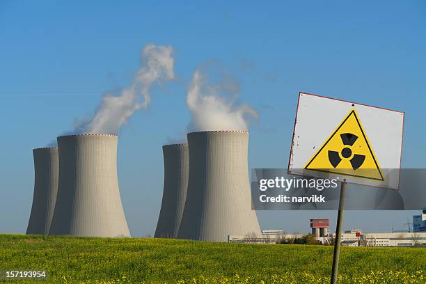 nuclear power plant with radioactivity sign - nuclear power station stock pictures, royalty-free photos & images