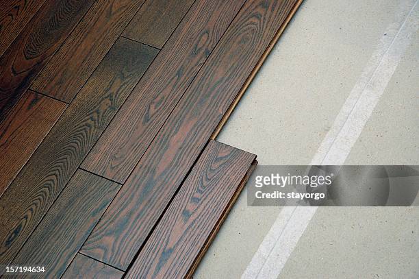 hardwood floor in the installation process - wood laminate flooring stock pictures, royalty-free photos & images