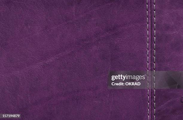 purple  leather texture with stitch detail - zoom in stockfoto's en -beelden