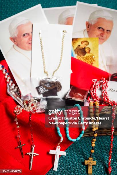 Rosaries sit in a basket waiting to be taken to Mexico with a group of parishioners from St. Jerome Catholic Community to see Pope Benedict during...