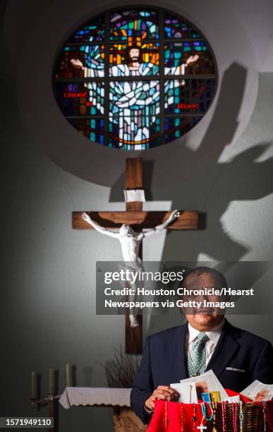 Deacon Pedro Salas of St. Jerome Catholic Community poses for a portrait in the church's sanctuary, Thursday, March 15 in Houston. Salas and his wife...