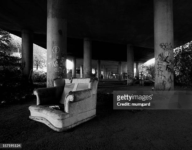 abandoned arm chair at an underpass - vintage crime scene photos 個照片及圖片檔