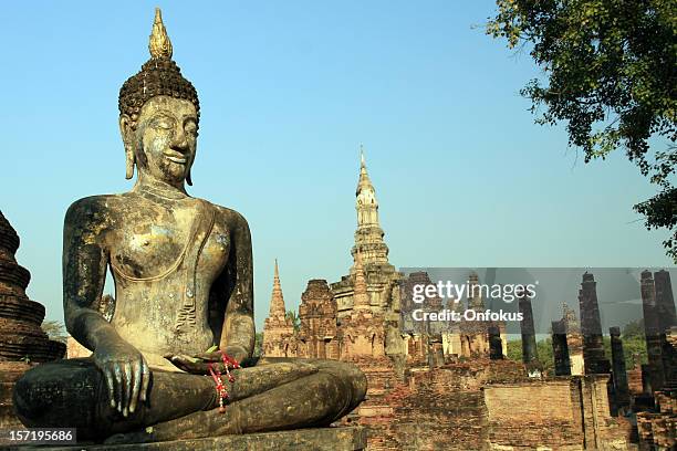 buddha and buddhist temple in sukhothai at sunrise - sukhothai stock pictures, royalty-free photos & images