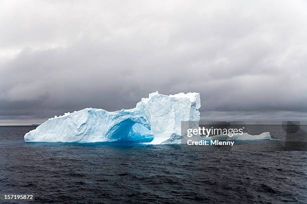natural archway iceberg antarctica - ice floe stock pictures, royalty-free photos & images