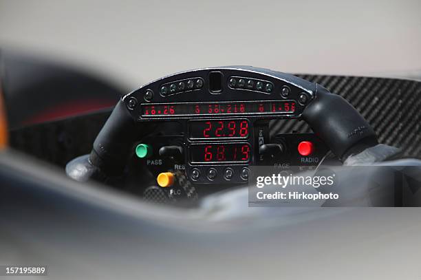 racing car steering wheel closeup - carbon fibre stock pictures, royalty-free photos & images