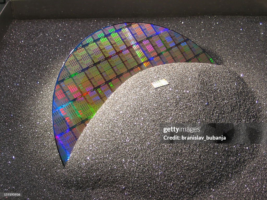 A silicon wafer covered with black sand